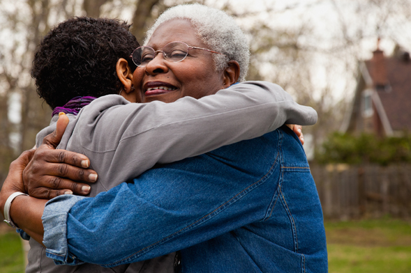 Friends embracing.