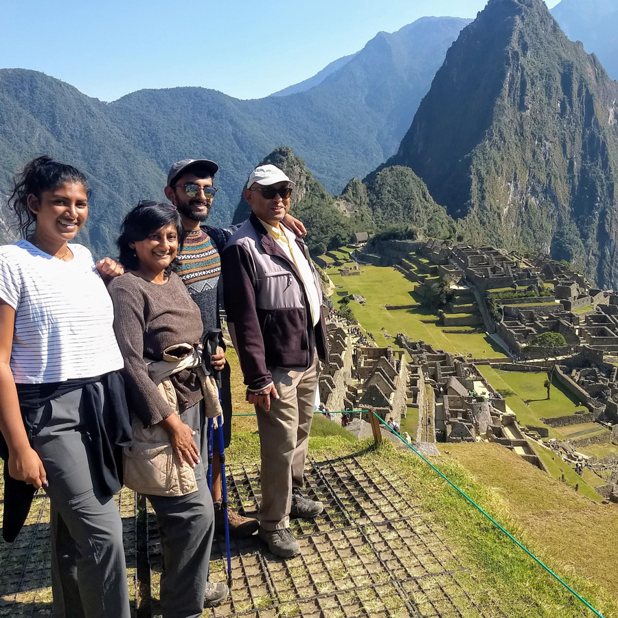 Photo of Vani Nilakantan and three adults.