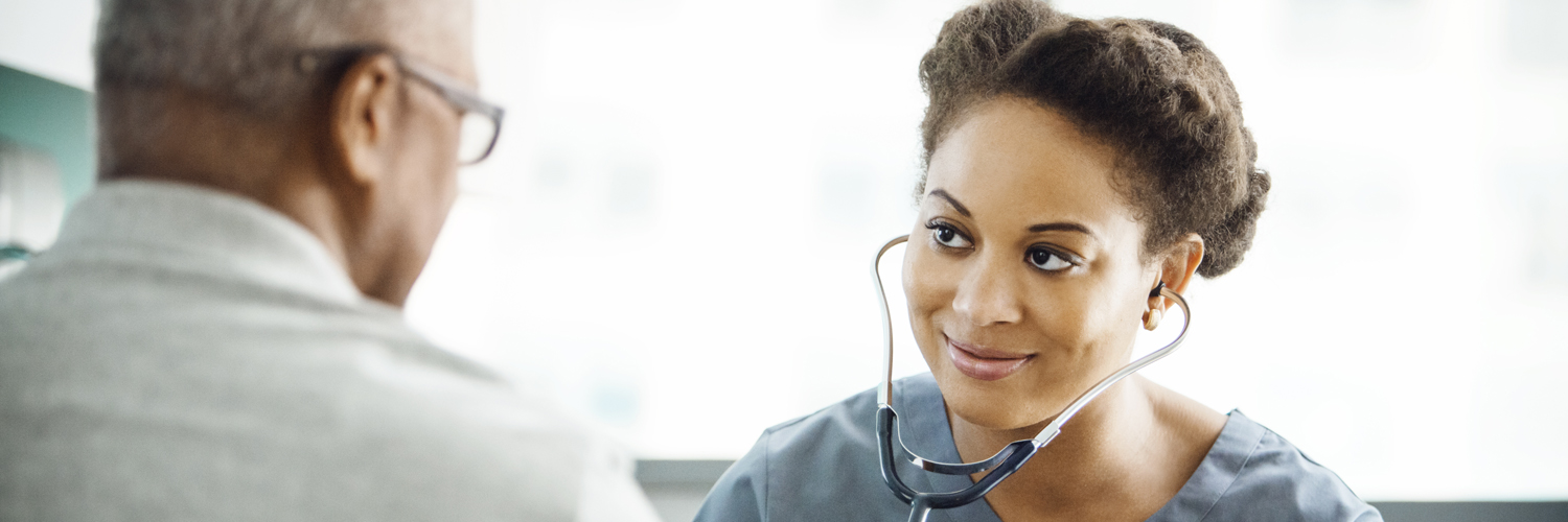 A Black doctor takes time to connect with a patient